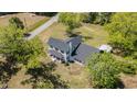 Beautiful home with mature trees, a new roof and detached carport on a sunny day at 675 Liberty Church Rd., Loris, SC 29569
