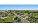 Aerial view of buildings and streets, many trees are visible with the ocean, the skyline, and clear blue skies in the background at 6804 N Ocean Blvd. # 1049, Myrtle Beach, SC 29572