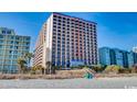 Oceanfront resort building with balcony views and beach access at 6804 N Ocean Blvd. # 1133, Myrtle Beach, SC 29572