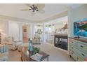 Open-concept living room showcases a fireplace, comfortable seating, and seamless transition to the kitchen at 719 Shearwater Ct. # 301, Murrells Inlet, SC 29576