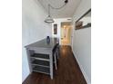 Small dining area with a table, chairs, and hardwood floors at 7509 N Ocean Blvd. # 1205, Myrtle Beach, SC 29572