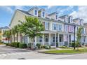 Attractive townhome exteriors with a welcoming porch, lush landscaping, and inviting curb appeal at 830 Shine Ave. # 28 R8, Myrtle Beach, SC 29577