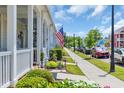 Neighborhood street view featuring well-maintained sidewalks, landscaping, and charming homes at 830 Shine Ave. # 28 R8, Myrtle Beach, SC 29577
