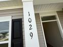 Close-up of the home's address with a window and black shutter at 1029 Jase Dr., Longs, SC 29568