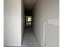 Hallway showing the unfinished condition of a home, as well as the natural light in a room at 1029 Jase Dr., Longs, SC 29568