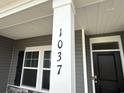 Closeup of home address on a pillar next to the window and a black front door with a smart lock at 1037 Jase Dr., Longs, SC 29568