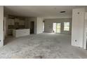 Spacious living area with a kitchen and island, sliding glass doors, and a large open floor plan at 1037 Jase Dr., Longs, SC 29568