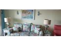 Cozy condo living room with beach-themed decor, including a comfortable sofa and charming decorative accents at 1311 S Ocean Blvd. # B-1, North Myrtle Beach, SC 29582
