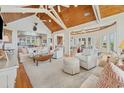 Expansive living room boasts a wooden ceiling, neutral furniture, and open access to other living areas at 172 Colony Point Dr., Georgetown, SC 29440