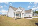 Angle shot of this beautiful one-story home showcasing its manicured lawn at 178 Six Mile Creek Dr., Georgetown, SC 29440