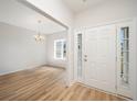 Bright foyer featuring hardwood floors and a view into the dining area at 178 Six Mile Creek Dr., Georgetown, SC 29440