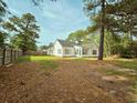 Spacious backyard with a nice fence and many mature trees providing good shade and privacy at 185 Lander Dr., Conway, SC 29526