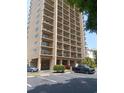 Exterior view showcasing the condo building with balconies and ample parking space for residents and guests at 210 75Th Ave N # 4042, Myrtle Beach, SC 29572