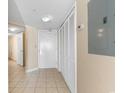 Hallway with tile flooring, a closet, and a door leading to another room at 2501 S Ocean Blvd. # 831, Myrtle Beach, SC 29577