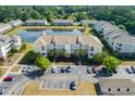 Aerial view of the condo community featuring well-maintained grounds and a pond at 334 Kiskadee Loop # 18-L, Conway, SC 29526