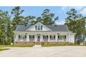 Beautiful one-story home boasts a covered front porch and neat landscaping at 4074 Center Rd., Georgetown, SC 29440
