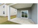 This house features a covered back porch with a sliding glass door that overlooks a small backyard at 532 Scarlet Sage Dr., Conway, SC 29527