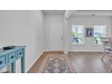 Inviting foyer with hardwood floors, white walls, and a view to the front yard at 5545 Whitebark Dr., Myrtle Beach, SC 29577