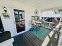 Inviting covered front porch with comfortable seating, perfect for enjoying the outdoors at 6001 - 1864 S Kings Hwy., Myrtle Beach, SC 29575