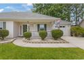 Inviting front porch with white picket fence and manicured shrubbery at 605 Cavandish Dr., Myrtle Beach, SC 29588