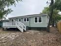 Rear view of the house, showcasing the back deck and well-maintained exterior at 803 34Th Ave. S, North Myrtle Beach, SC 29582