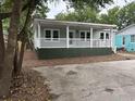 Inviting single-story home featuring a covered porch, well-maintained landscaping, and a welcoming facade at 803 34Th Ave. S, North Myrtle Beach, SC 29582