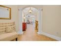 Elegant hallway featuring arched columns, a decorative console table, and warm neutral tones at 8546 San Marcello Dr. # 1-102, Myrtle Beach, SC 29579