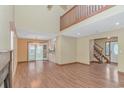 Bright living room boasting hardwood floors, high ceilings, and a decorative fireplace at 934 Tiffany Ln., North Myrtle Beach, SC 29582