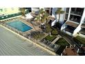 Stunning aerial view of a sparkling pool, beach access and lush landscaping that offers serenity at 9500 Shore Dr. # 17B, Myrtle Beach, SC 29572