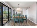 Bright dining area with table, chairs, and sliding glass doors leading to a balcony with a beautiful view at 9661 Shore Dr. # B-3, Myrtle Beach, SC 29572