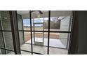 View of the backyard through the screened-in porch with a concrete floor at Tbd 80 Persimmon Rd., Aynor, SC 29511