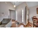 Inviting home foyer featuring a white front door, hardwood floors, and neutral decor at 113 Camrose Way, Myrtle Beach, SC 29588