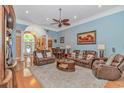 Spacious living room featuring hardwood floors, comfortable seating, and a view into the entry at 1206 Spinnaker Dr., North Myrtle Beach, SC 29582