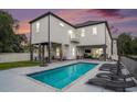 Back exterior view showcasing a private pool with lounge chairs and covered outdoor seating area at 1279 Fiddlehead Way, Myrtle Beach, SC 29579