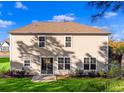 The back of this two-story home has a sliding glass door and lots of windows facing a lush green yard at 1303 Bermuda Grass Dr., Myrtle Beach, SC 29579