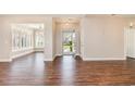Spacious living area featuring lovely laminate flooring and a clear view of the open doorway at 1435 Saint Thomas Circle # E-1, Myrtle Beach, SC 29577