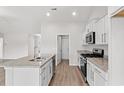 Modern kitchen with granite countertops, stainless steel appliances, and an island with a sink at 154 Six Mile Creek Dr., Georgetown, SC 29440
