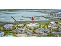 Aerial view of condo complex near the bay with parking and surrounding trees at 1582 S Waccamaw Dr. # 34, Garden City Beach, SC 29576