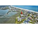 Aerial view of condo complex near the ocean, bay and neighborhood at 1582 S Waccamaw Dr. # 34, Garden City Beach, SC 29576