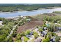 Expansive aerial view of community and adjacent waterway, offering serene natural beauty at 2191 Liberty Circle, Little River, SC 29566