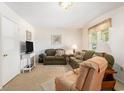 Comfortable living room area with plush seating, carpet flooring, and lots of natural light at 2191 Liberty Circle, Little River, SC 29566