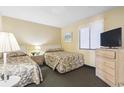 Traditional bedroom with two twin beds, window with blinds, lamp, nightstand and tv at 2511 S Ocean Blvd. S # 1802B, Myrtle Beach, SC 29577