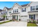 Charming townhouses with well-manicured landscaping and white siding at 253 Bent Green Ct. # 70D, Murrells Inlet, SC 29576