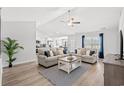 Bright, open living room featuring vaulted ceilings, neutral decor, and modern furnishings at 259 Stillbrook Dr., Longs, SC 29568