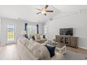 Comfortable living room with lots of natural light, plush sofas, and stylish accents at 259 Stillbrook Dr., Longs, SC 29568