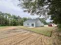 The backyard of the property with partial landscaping at 2593 Main St., Loris, SC 29569