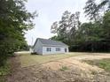 A partial view of the back of the property with some minor landscaping at 2593 Main St., Loris, SC 29569
