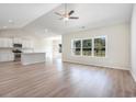 Open living space showcasing wood-look floors and abundant natural light at 268 Stillbrook Dr., Longs, SC 29568