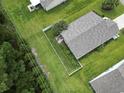 Birds eye view of a backyard featuring a small patio with furniture and mature trees for privacy at 424 Enderby Way, Little River, SC 29566