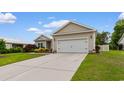 Exterior of a home showing the two car garage with a concrete driveway and well maintained lawn at 4419 Kinlaw St., Little River, SC 29566